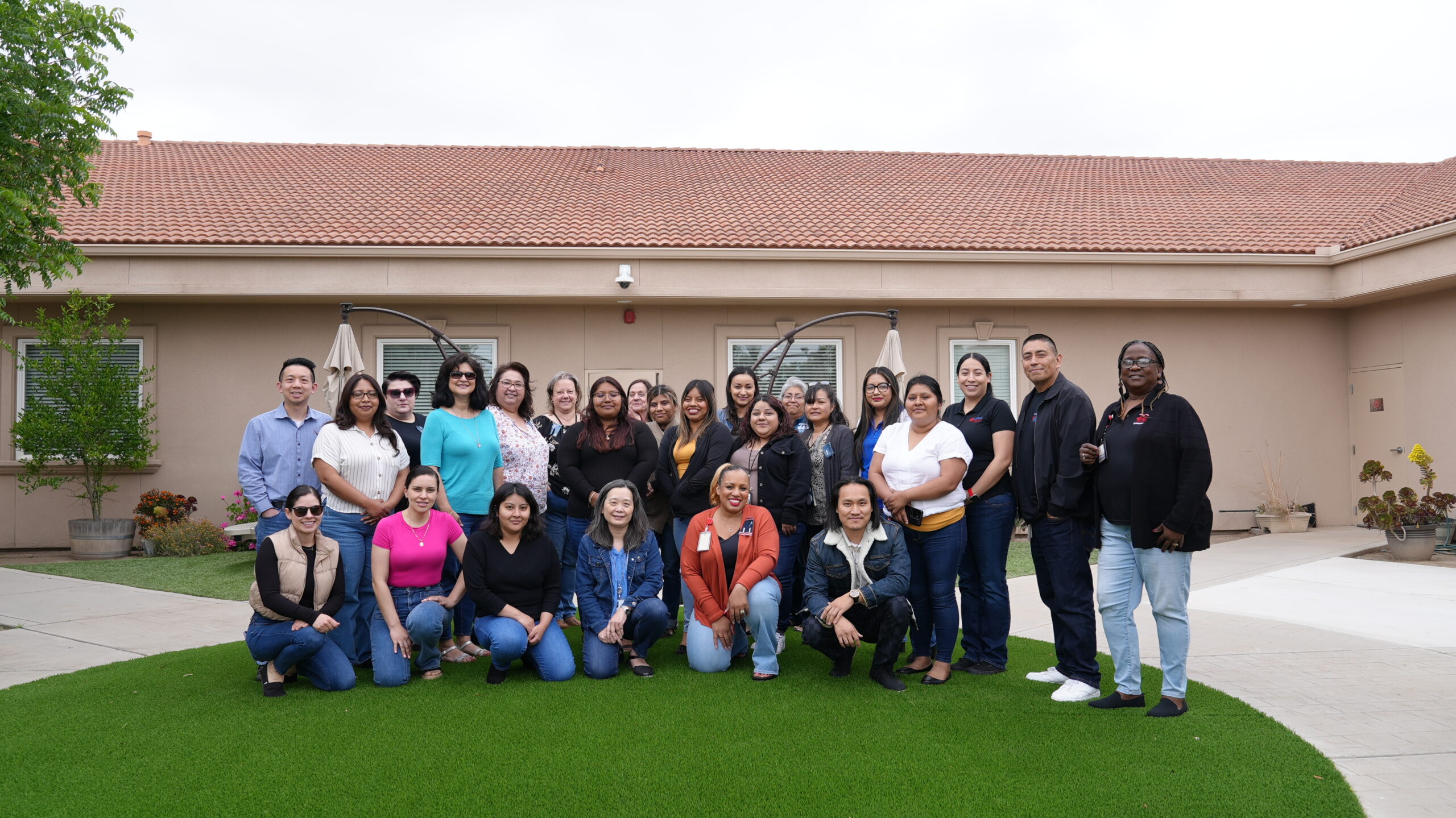 Community Action Partnership of Madera County Employees standing in front of the main admin building (Gill Avenue Office)